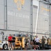 Sailors and Marines Run on the Flight Deck Aboard USS Tripoli