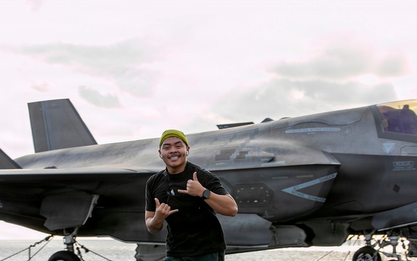 Sailors and Marines Run on the Flight Deck Aboard USS Tripoli