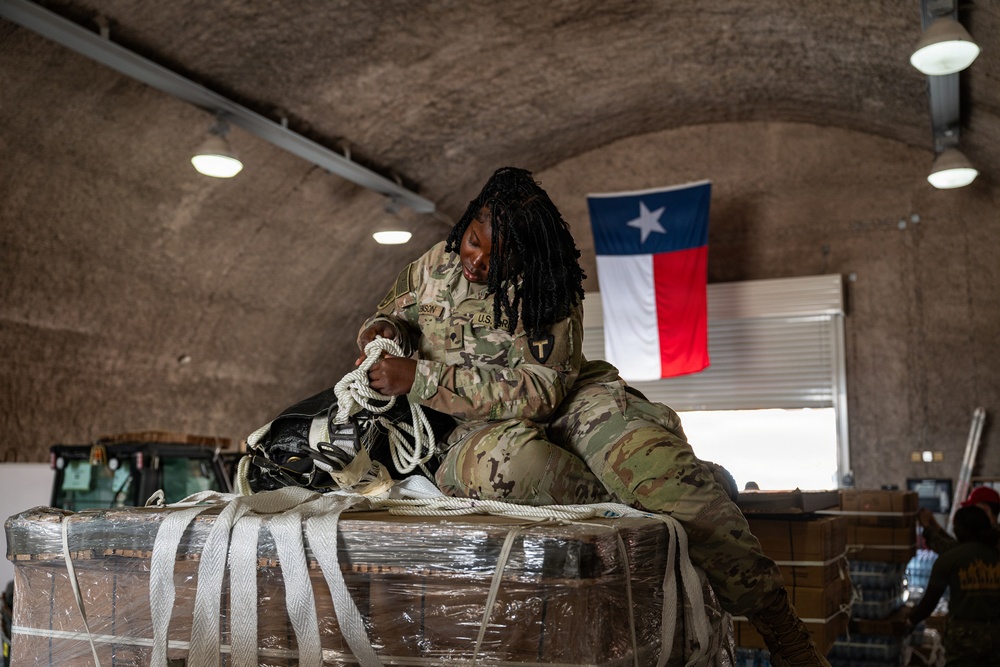 Texas National Guard 294th QM packages food, water for aerial delivery