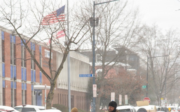Service members conduct presence patrols during the winter