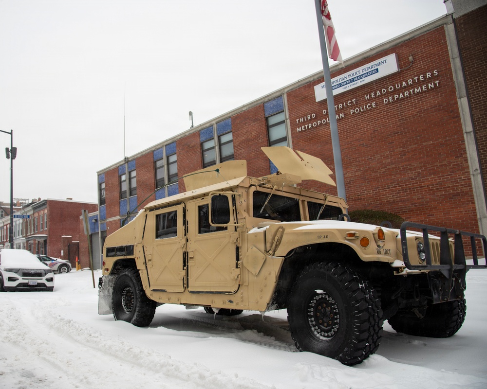 Service members conduct presence patrols during the winter