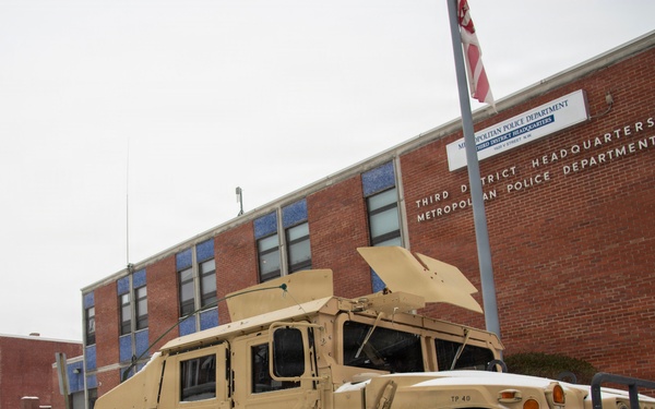 Service members conduct presence patrols during the winter
