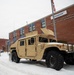 Service members conduct presence patrols during the winter