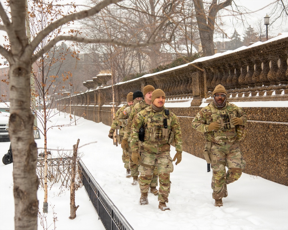 Service members conduct presence patrols during the winter