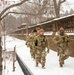 Service members conduct presence patrols during the winter