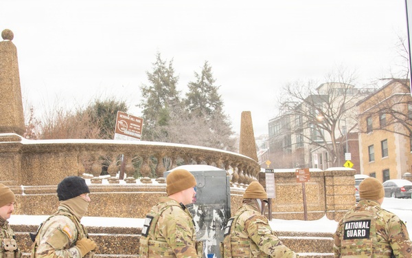 Service members conduct presence patrols during the winter