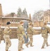 Service members conduct presence patrols during the winter