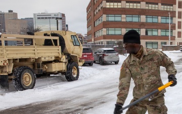Soldier Shovels Snow