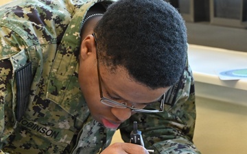 Opreations Specialist students participate in hands-on learning