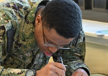 Opreations Specialist students participate in hands-on learning