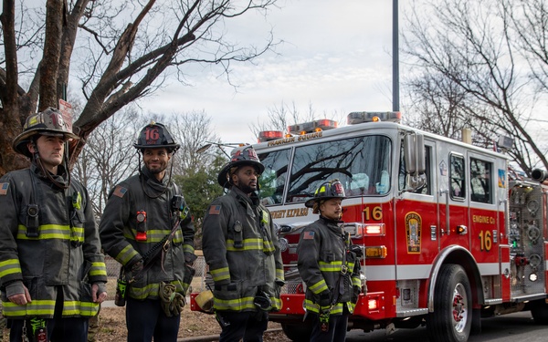 District of Columbia Firefighters arrive to render honors during a funeral escort in Washington, D.C.