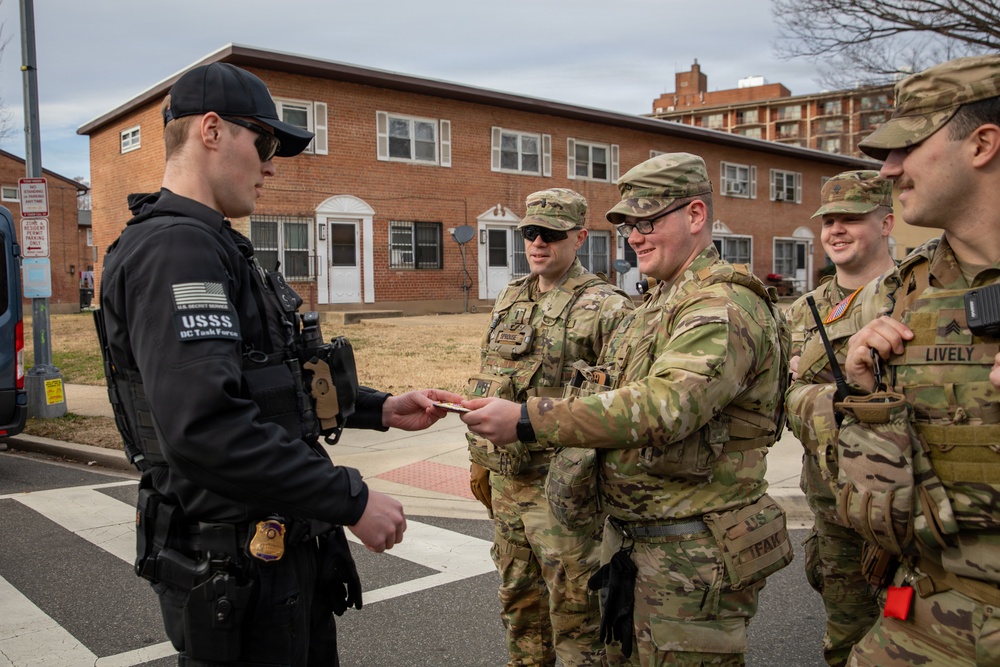 An Ohio National Guard Soldier interacts with a U.S. Secret Service agent in Washington, D.C.