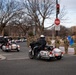 National Guard service members salute a fallen officer during a dignified escort in Washington, D.C.