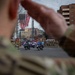 National Guard service members salute a fallen officer during a dignified escort in Washington, D.C.