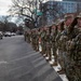 Mississippi National Guard service members salute a fallen officer during a dignified escort in Washington, D.C.