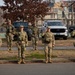 National Guard service members salute a fallen officer during a dignified escort in Washington, D.C.