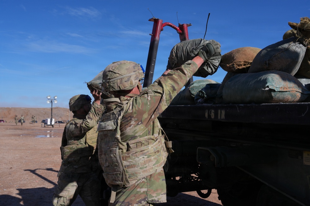 Heavy Lifting: Soldiers Tackle Sandbag Lifts During E3B Assessment