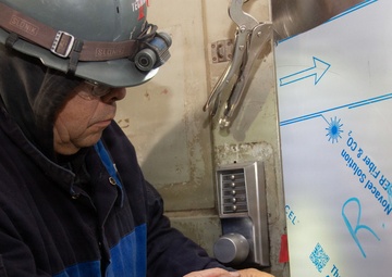 Ronald Reagan Sailors and Contractors Carry Out Maintenance