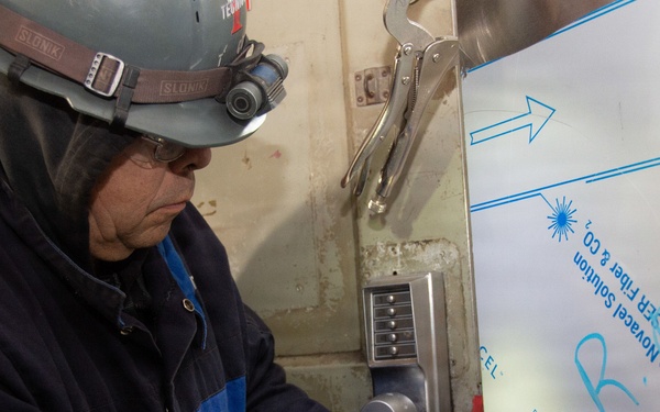 Ronald Reagan Sailors and Contractors Carry Out Maintenance