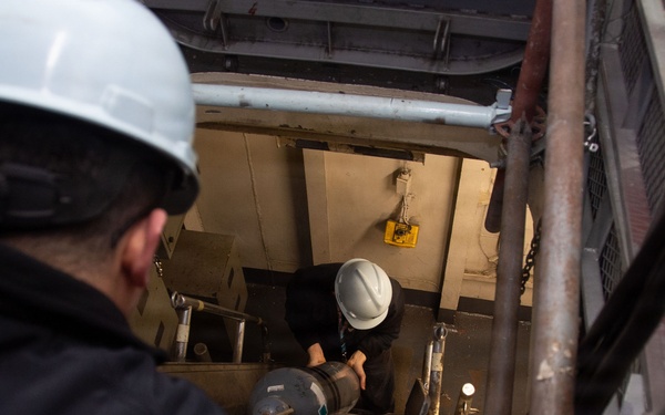 Ronald Reagan Sailors and Contractors Carry Out Maintenance