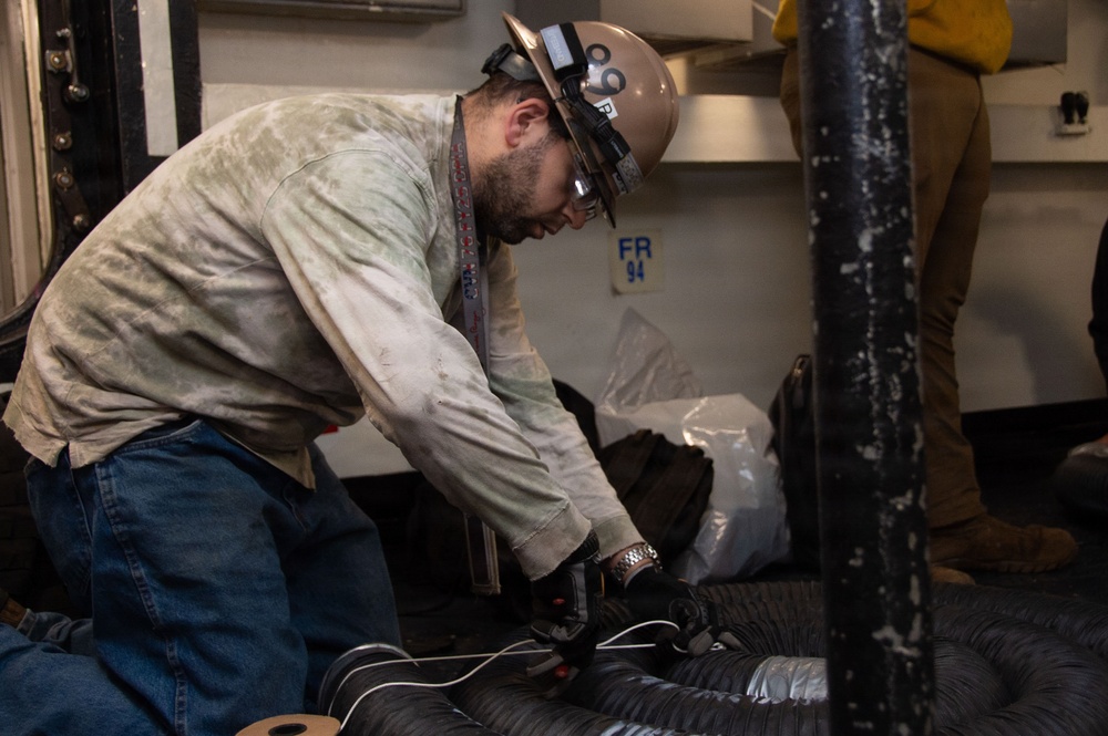 Ronald Reagan Sailors and Contractors Carry Out Maintenance