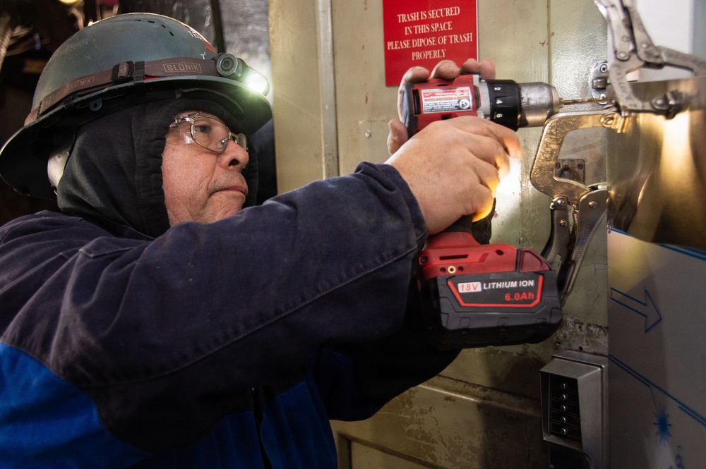 Ronald Reagan Sailors and Contractors Carry Out Maintenance