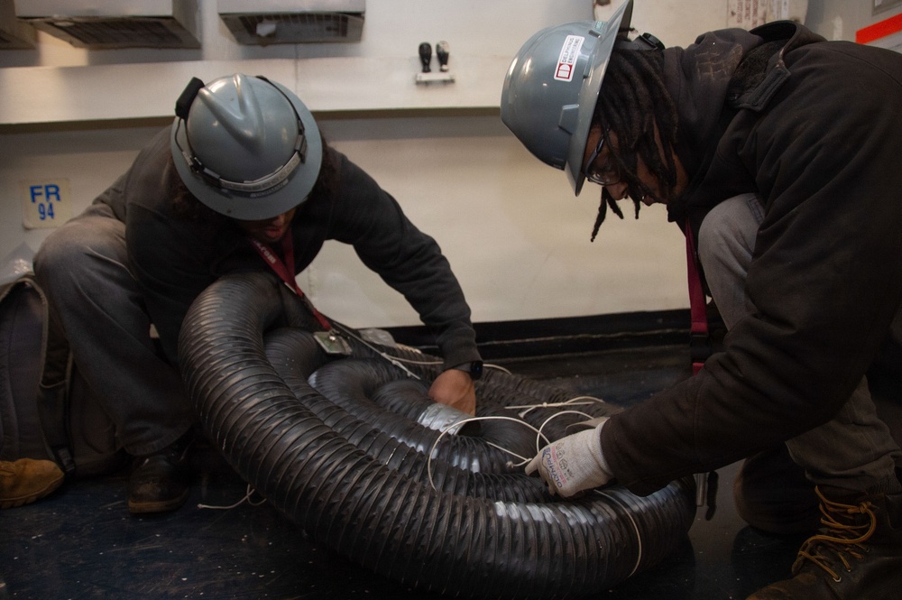 Ronald Reagan Sailors and Contractors Carry Out Maintenance