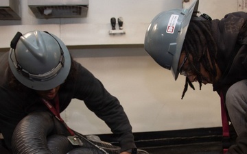 Ronald Reagan Sailors and Contractors Carry Out Maintenance