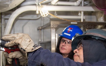 Ronald Reagan Sailors and Contractors Carry Out Maintenance