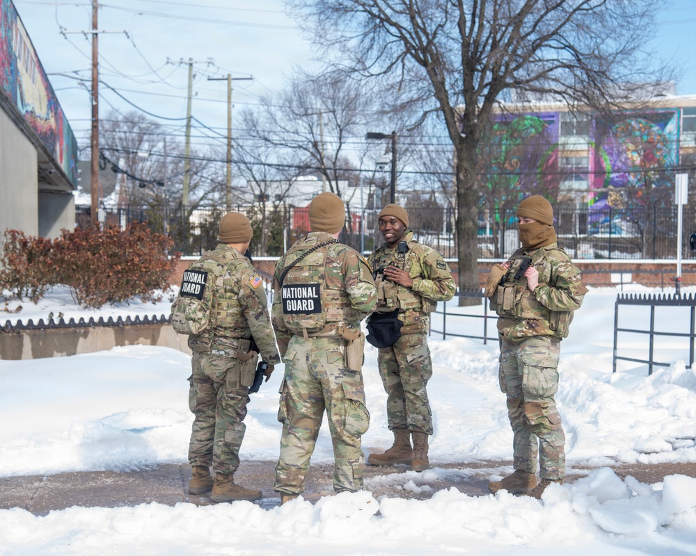 Service members perform duties in heavy snow
