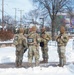 Service members perform duties in heavy snow