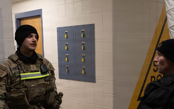U.S. Army National Guard Lt. John Coulman Speaks to a Maryland State Police Officer during Operation Blur