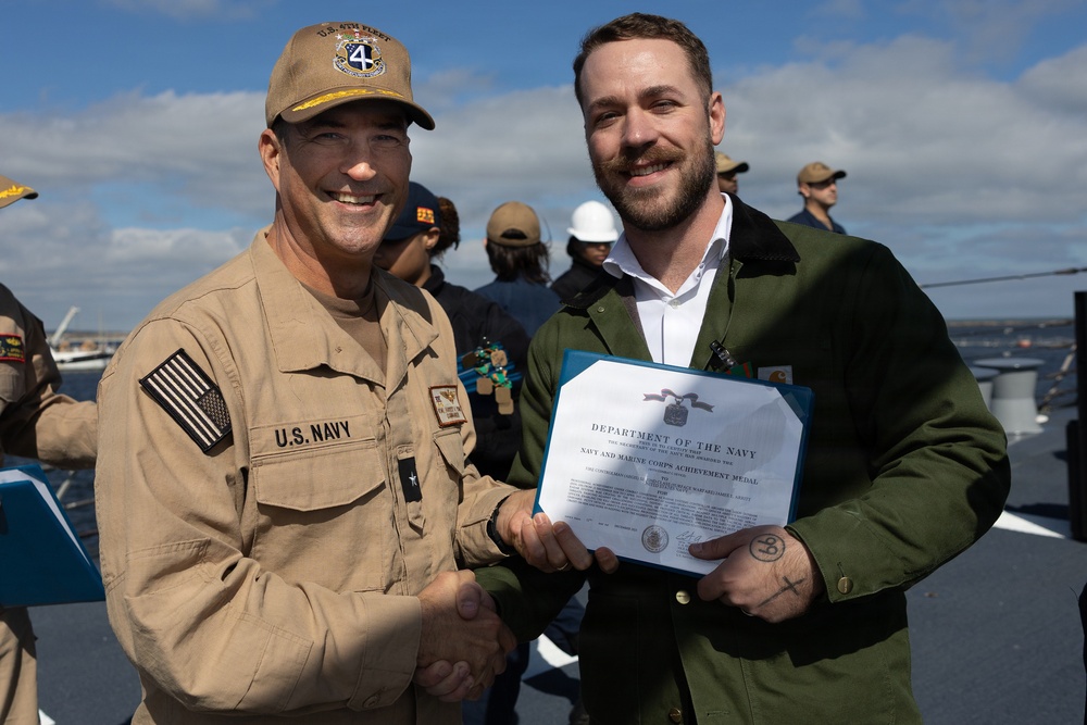 Rear Adm. Forrest Young, Commander, Carrier Strike Group (CSG) 8, Presents Awards to USS Jason Dunham (DDG 109)