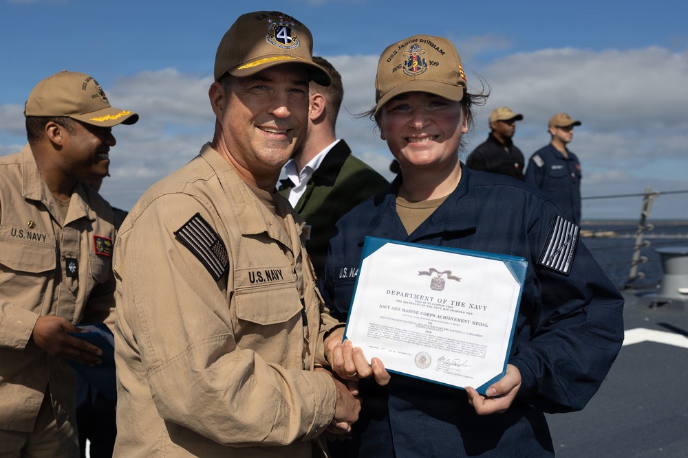 Rear Adm. Forrest Young, Commander, Carrier Strike Group (CSG) 8, Presents Awards to USS Jason Dunham (DDG 109)
