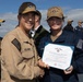 Rear Adm. Forrest Young, Commander, Carrier Strike Group (CSG) 8, Presents Awards to USS Jason Dunham (DDG 109)