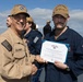 Rear Adm. Forrest Young, Commander, Carrier Strike Group (CSG) 8, Presents Awards to USS Jason Dunham (DDG 109)
