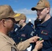 Rear Adm. Forrest Young, Commander, Carrier Strike Group (CSG) 8, Presents Awards to USS Jason Dunham (DDG 109)
