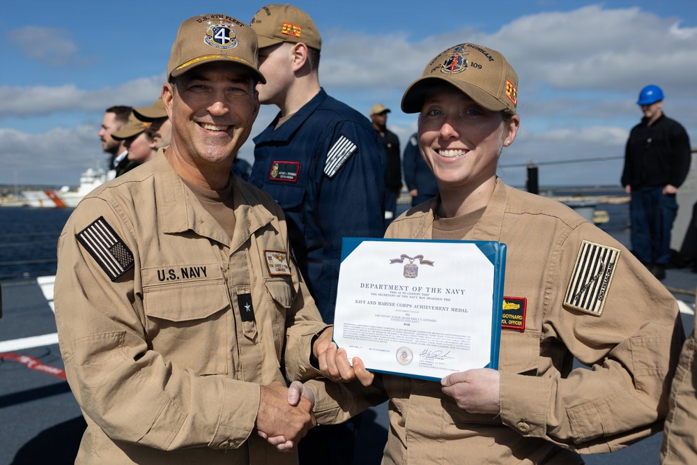 Rear Adm. Forrest Young, Commander, Carrier Strike Group (CSG) 8, Presents Awards to USS Jason Dunham (DDG 109)