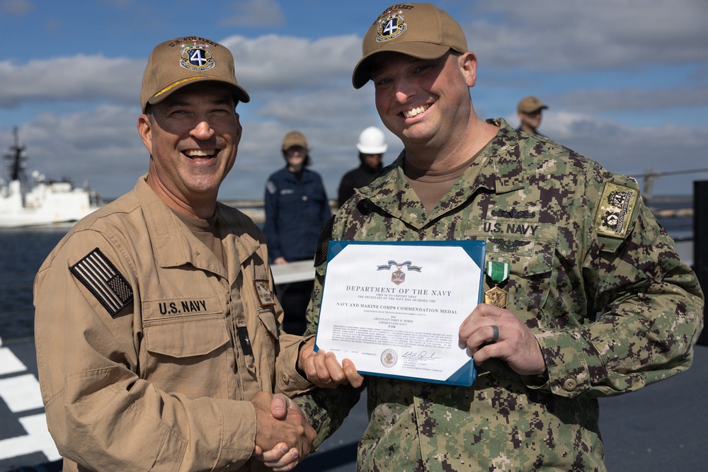Rear Adm. Forrest Young, Commander, Carrier Strike Group (CSG) 8, Presents Awards to USS Jason Dunham (DDG 109)