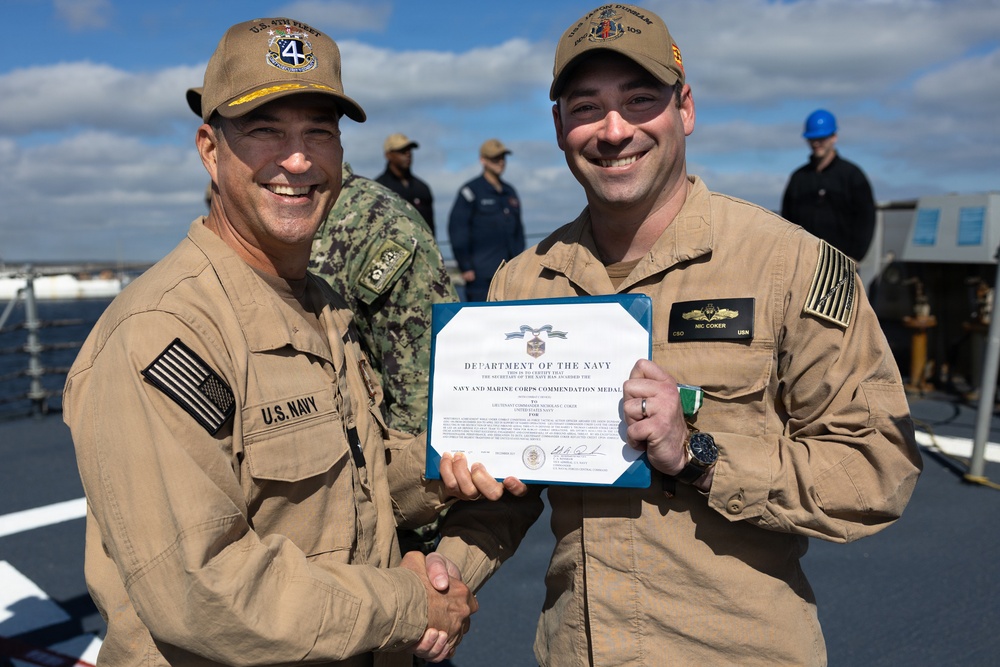 Rear Adm. Forrest Young, Commander, Carrier Strike Group (CSG) 8, Presents Awards to USS Jason Dunham (DDG 109)