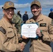 Rear Adm. Forrest Young, Commander, Carrier Strike Group (CSG) 8, Presents Awards to USS Jason Dunham (DDG 109)