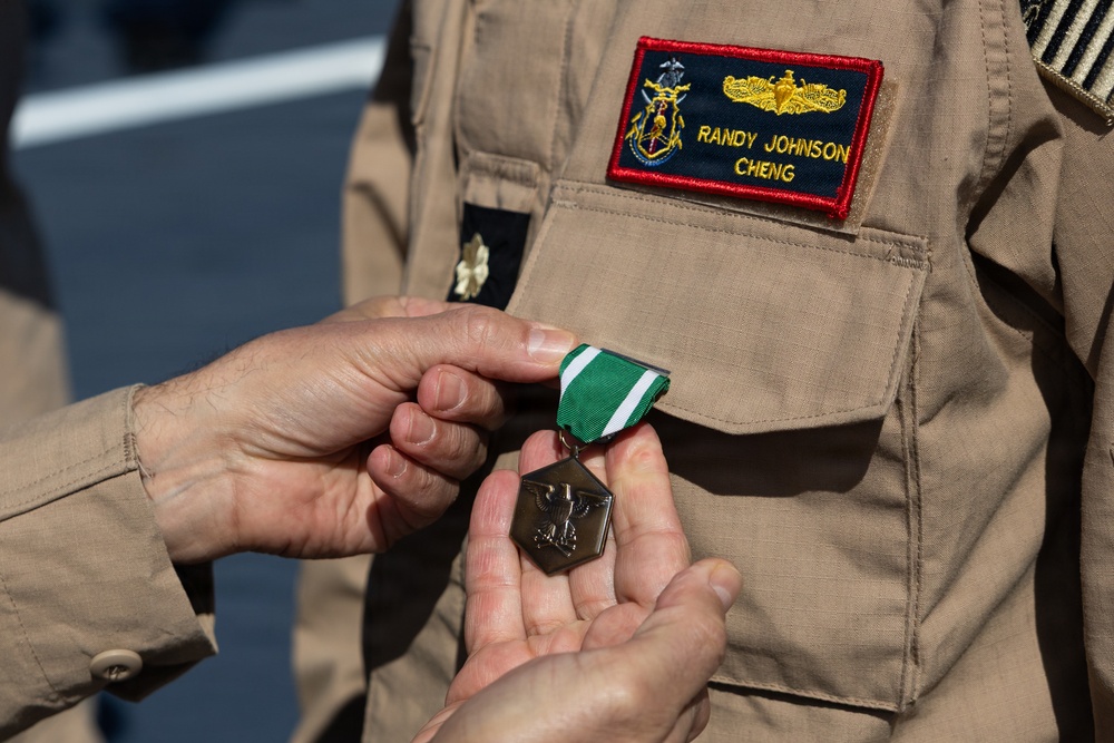 Rear Adm. Forrest Young, Commander, Carrier Strike Group (CSG) 8, Presents Awards to USS Jason Dunham (DDG 109)