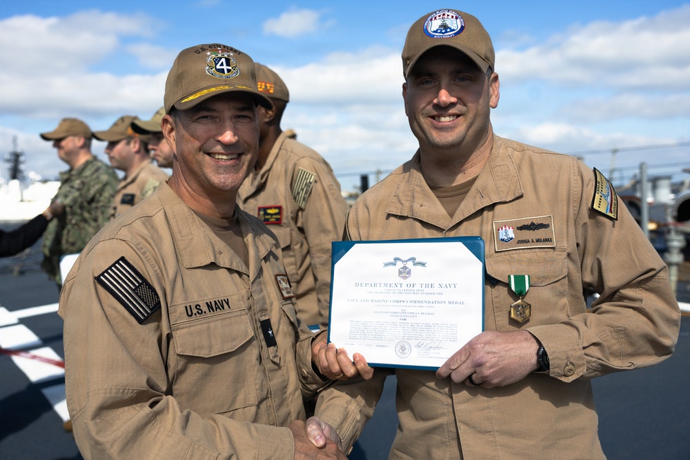 Rear Adm. Forrest Young, Commander, Carrier Strike Group (CSG) 8, Presents Awards to USS Jason Dunham (DDG 109)