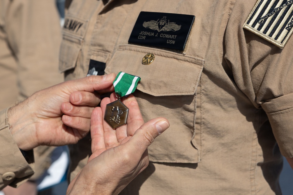 Rear Adm. Forrest Young, Commander, Carrier Strike Group (CSG) 8, Presents Awards to USS Jason Dunham (DDG 109)