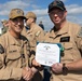 Rear Adm. Forrest Young, Commander, Carrier Strike Group (CSG) 8, Presents Awards to USS Jason Dunham (DDG 109)