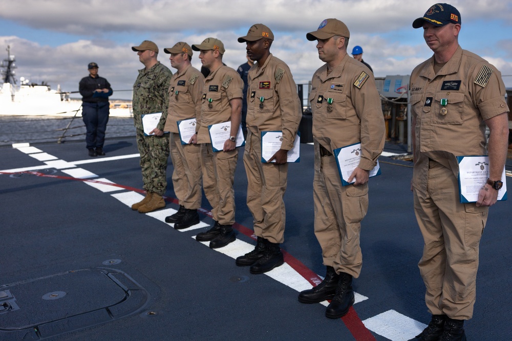 Rear Adm. Forrest Young, Commander, Carrier Strike Group (CSG) 8, Presents Awards to USS Jason Dunham (DDG 109)