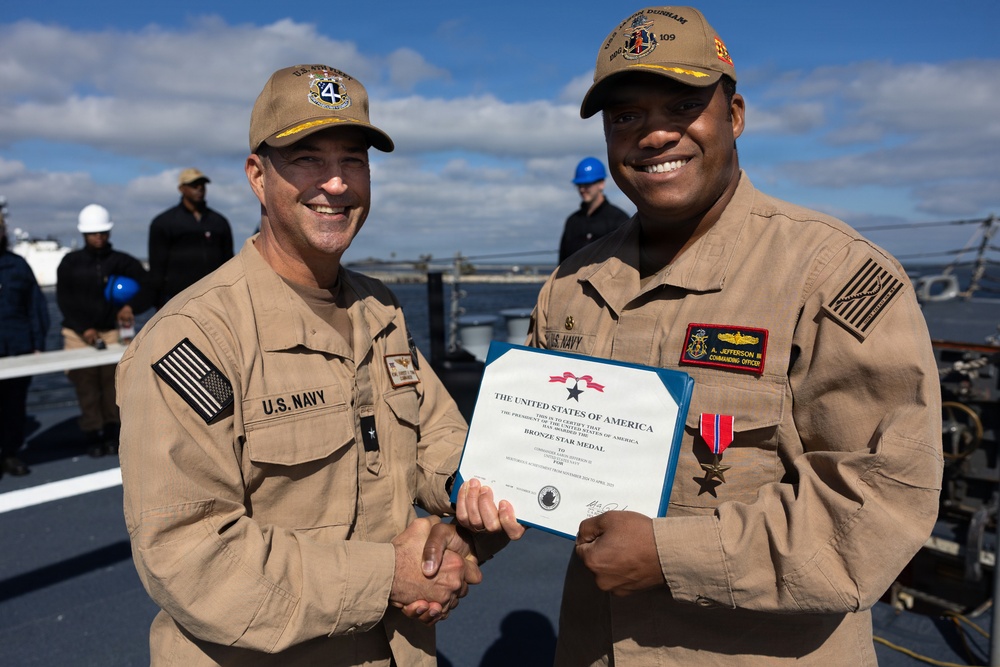 Rear Adm. Forrest Young, Commander, Carrier Strike Group (CSG) 8, Presents Awards to USS Jason Dunham (DDG 109)