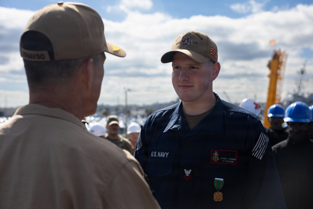 Rear Adm. Forrest Young, Commander, Carrier Strike Group (CSG) 8, Presents Awards to USS Jason Dunham (DDG 109)