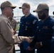 Rear Adm. Forrest Young, Commander, Carrier Strike Group (CSG) 8, Presents Awards to USS Jason Dunham (DDG 109)