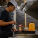 USS Theodore Roosevelt Sailor Prepares a Meal